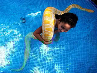 Photos: Israeli girl makes a splash with her pet snake