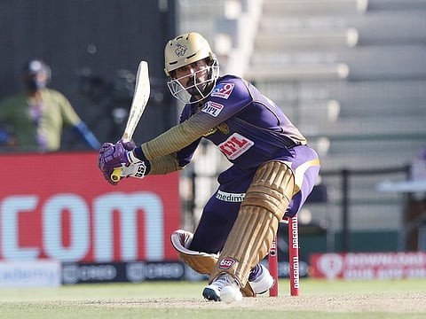 Dinesh Karthik, captain of Kolkata Knight Riders, plays a sweep shot against Kings XI Punjab in the IPL 2020 game in Abu Dhabi on October 10,2020.