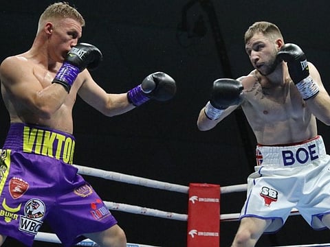 Maxi Hughes on his way to victory over Viktor Kotochigov in Dubai