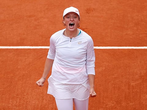 Poland's Iga Swiatek celebrates after winning the French Open final against Sofia Kenin 