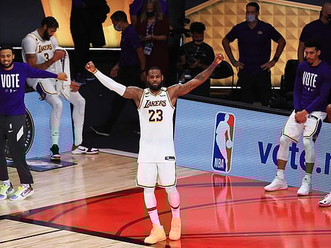  LeBron James of the Los Angeles Lakers reacts after winning the 2020 NBA Championship.
