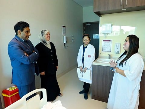 Emma masangcay with her doctors Rajkumar and Basma after her surgery at Burjeel Specialty hospital Sharjah.