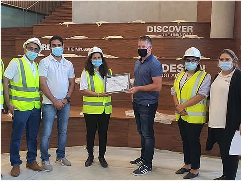 The team celebrates the commitment to health and safety