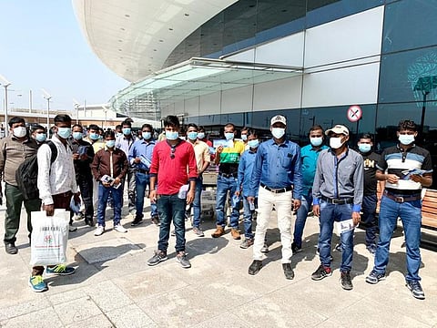 Indian workers before repatrations at the airport. Some 49 carpenters were sent back home from UAE with the help of Dubai Police.