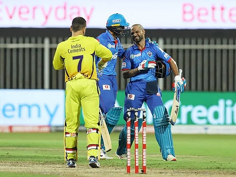 Shikhar Dhawan (right) and Axar Patel of Delhi Capitals celebrate their victory. 