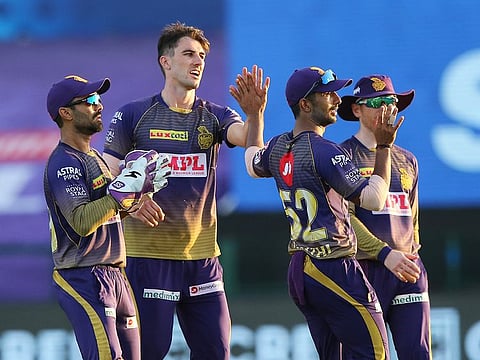 Kolkata Knight Riders players celebrate the fall of a wicket during their campaign in IPL in the UAE.
