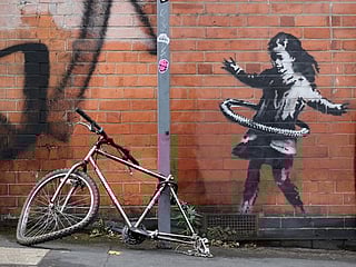 British artist Banksy claims hula-hooping girl street art