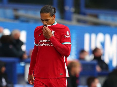 Liverpool's Dutch defender Virgil van Dijk leaves the field injured.