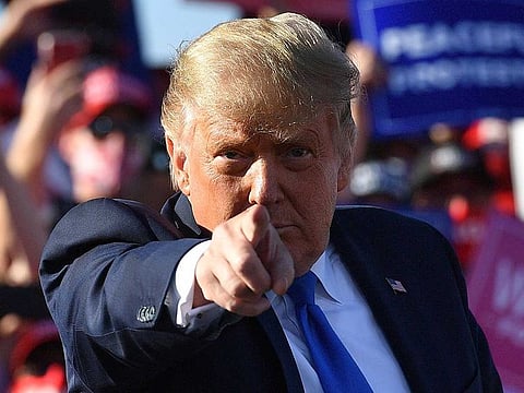 US President Donald Trump gestures as he speaks during a rally at Carson City Airport in Carson City, Nevada on October 18, 2020. 