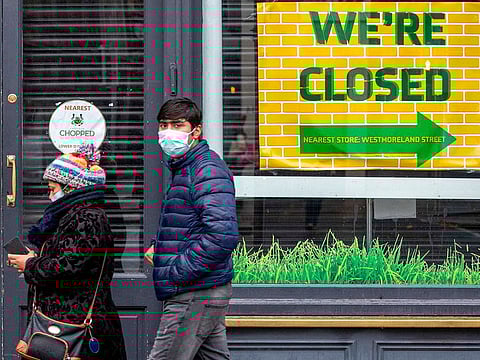 Pedestrians wearing face masks as a precautionary measure against spreading COVID-19, in Dublin, Ireland on October 19, 2020.