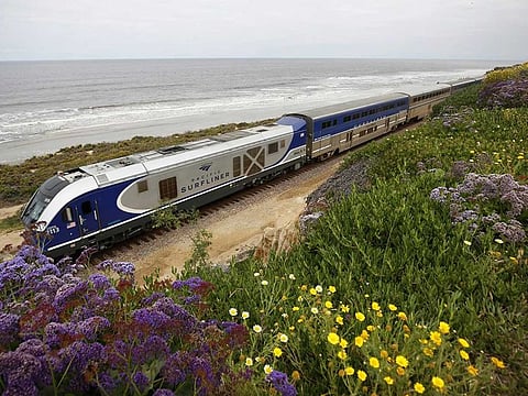An Amtrak Pacific Surfliner train heads south near 6th Street in Del Mar on May 11, 2020. 