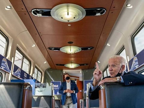 Democratic presidential candidate former Vice President Joe Biden speaks with United Steelworkers Union President Thomas Conway and school teacher Denny Flora of New Castle, Pa., aboard his train as it travels to Pittsburgh, Wednesday, Sept. 30, 2020. Biden is on a train tour through Ohio and Pennsylvania today. 
