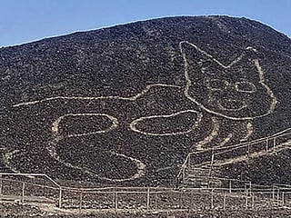 Photos: Peruvian archaeologists unveil giant cat carved into Nazca hillside 
