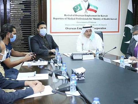 PM’s Special Assistant on Overseas Pakistanis, Zulfikar Abbas Bukhari, and the ambassador of Kuwait to Pakistan, Nasr Abdul Rehman J Al Mutairi, address healthcare professionals leaving for Kuwait on October 21, 2020 in Islamabad, Pakistan. 