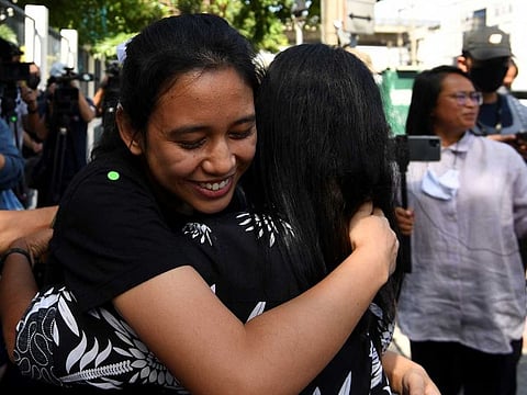One of Thailand's protest leaders, Patsaravalee "Mind" Tanakitvibulpon reacts after she was freed on bail, in Bangkok Thailand October 22, 2020.