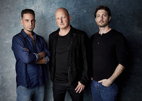 James Safechuck, from right, director Dan Reed and Wade Robson pose for a portrait to promote the film 'Leaving Neverland' during the Sundance Film Festival on Jan. 24, 2019, in Park City, Utah.