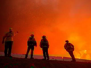 Pictures: Thousands flee homes near Los Angeles as wildfires rage