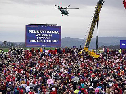 Marine One helicopter, with President Donald Trump aboard, lands at the Altoona-Blair County Airport in Martinsburg, Pa, Monday, Oct. 26, 2020 for a campaign rally. 