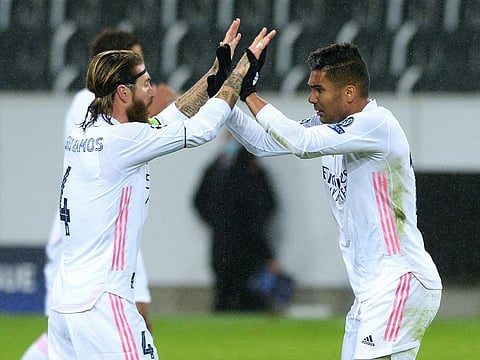 Real Madrid's Casemiro celebrates scoring their second goal with Sergio Ramos.
