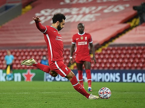 Liverpool's Mohamed Salah scores his side's second goal from a penalty .