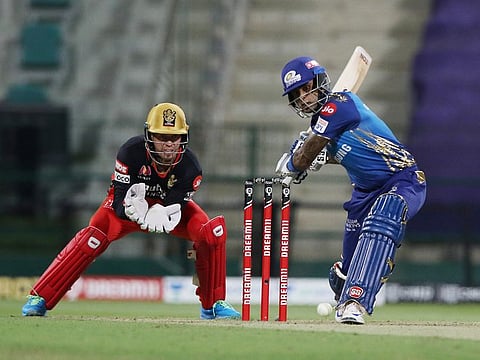 Suryakumar Yadav of the Mumbai Indians drives against the Royal Challengers Bangalore in the IPL 2020 game in Abu Dhabi on October 28, 2020.