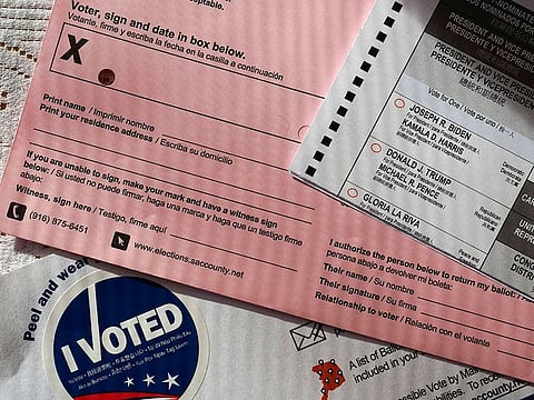 A ballot, one of many sent to every California voter, shows the portion where the voter would have to authorize another person to deposit it on their behalf, is seen in Sacramento, California.