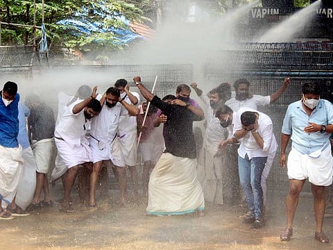 Police use water cannon to disperse Youth Congress workers, protesting outside CM's official residence Cliff House, in Thiruvananthapuram on Thursday, October 29, 2020.