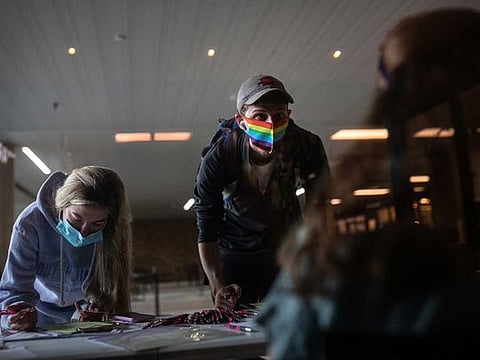 Texas State University students register to vote in Hays County during a National Voter Registration Day event on campus in San Marcos, Texas, on Sept. 22. 
