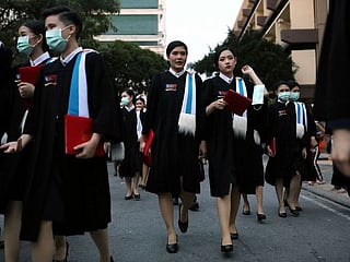 Photos: Protesting Thai students boycott royal graduation day
