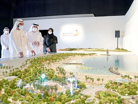 Sheikh Mohammed inspects a scale model of the project.