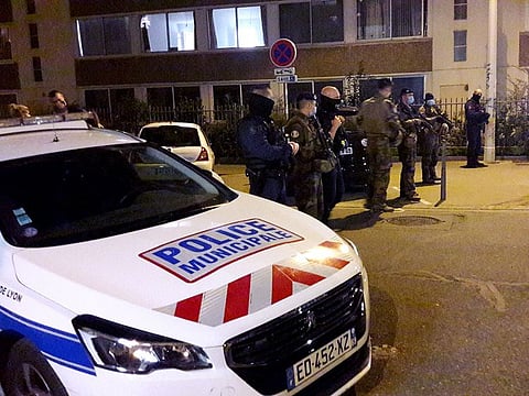 Police secures a street after a Greek Orthodox priest was shot and injured at a church in the centre of Lyon, France. 