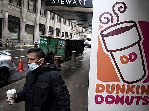 The Dunkin' Donuts sign has pride of place in a Manhattan borough. After being bought for $11.3b, the brand has picked up quite a few bragging rights.