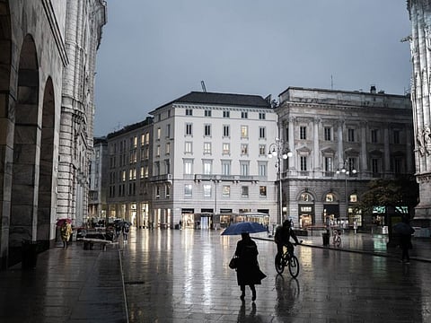 A nearly empty street in Milan on Oct. 26, 2020, the first day the city imposed new restrictions to prevent the spread of the coronavirus.