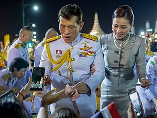 Photos: Thai king and queen take to street to meet adoring royalists