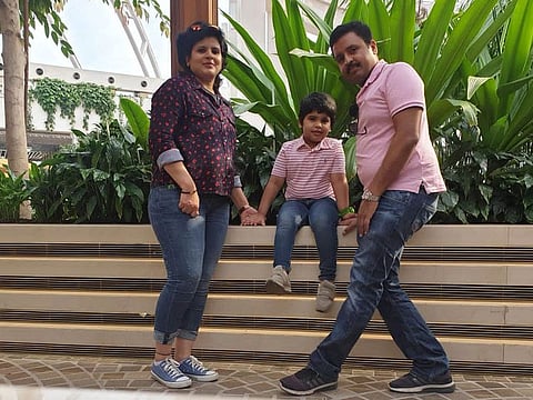Winner of Dh15 million Abu Dhabi Big ticket draw Nobin Mathew with his family.