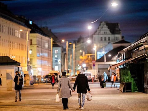 People visit the Naschmarkt in Vienna on November 2, 2020, a few hours before a second lockdown during the ongoing novel coronavirus pandemic. 