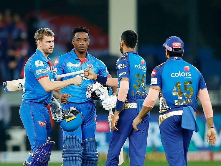 Mumbai and Delhi players greet each other