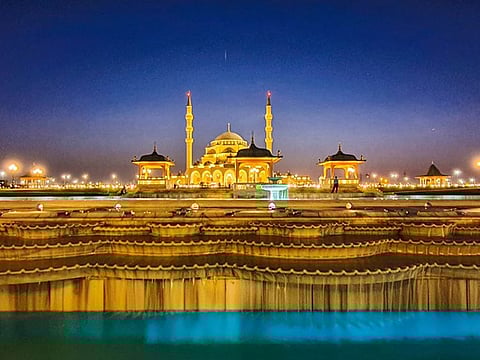 A mosque illuminated by lights in Sharjah, UAE. There are 700 Quran memorisation sessions being held in mosques across the emirate during the holy month of Ramadan.