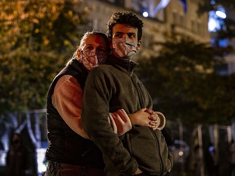 People gather at Black Lives Matter Plaza to listen to a live broadcast of Democratic presidential nominee Joe Biden as he speaks from Chase Centre in Wilmington, Delaware on November 6.