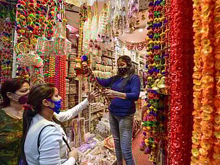 Photos: COVID-19, air pollution cut firecracker demand for Diwali