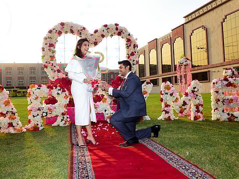 Vijay Valecha and Radhika Doshi, former students of the Indian High School during the wedding proposal at the IHS premises.