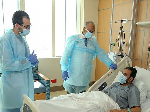 A Patient who received a donated organ is being checked by doctors. 
