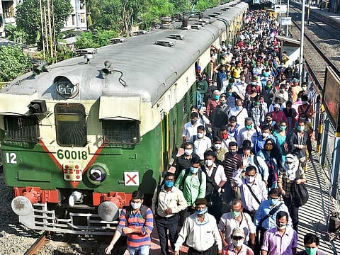 Passengers at Bidhan Nagar railway station in Kolkata after local train services resumed on Wednesday, November 11, 2020. 