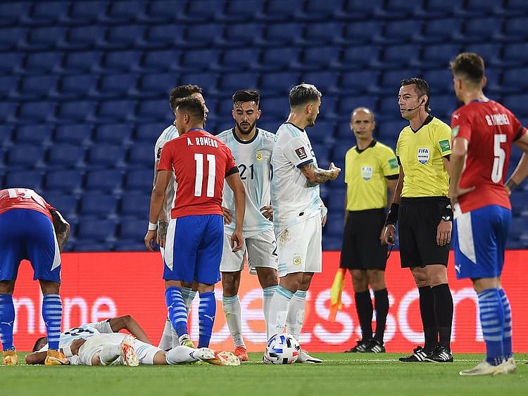 Argentina's Exequiel Palacios lies injured during the World Cup qualifier against Paraguay 