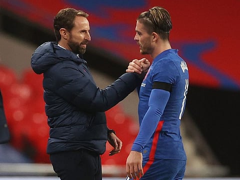 England coach Gareth Southgate (left) with Jack Grealish.