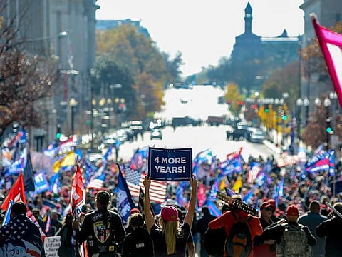 Supporters of President Donald Trump rally in support of the president, near Freedom Plaza in Washington on Saturday, Nov. 14, 2020.