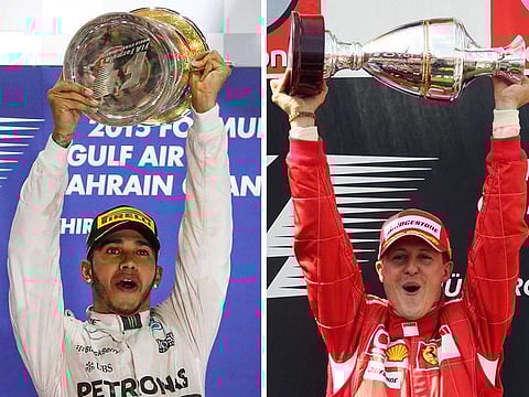 Mercedes AMG Petronas British driver Lewis Hamilton (L) celebrating winning the Formula One Bahrain Grand Prix, on April 19, 2015, in Manama; and Ferrari's German driver Michael Schumacher celebrating winning the Grand Prix of Europe on May 7, 2006, in Nurburg