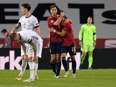 Spain midfielder Ferran Torres (R) celebrates his third goal with namesake Pau Torres during the Nations League match against Germany at La Cartuja stadium in Seville on November 17, 2020.