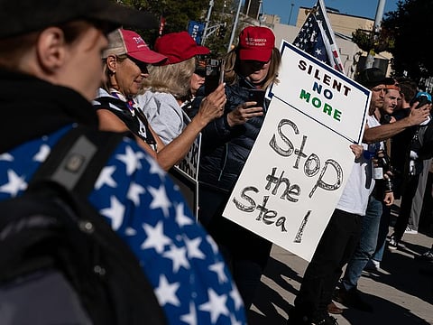Pro-Trump protesters attend a "Stop the Steal" rally against the results of the U.S. Presidential election outside the Georgia State Capitol on November 18, 2020 in Atlanta, Georgia.  