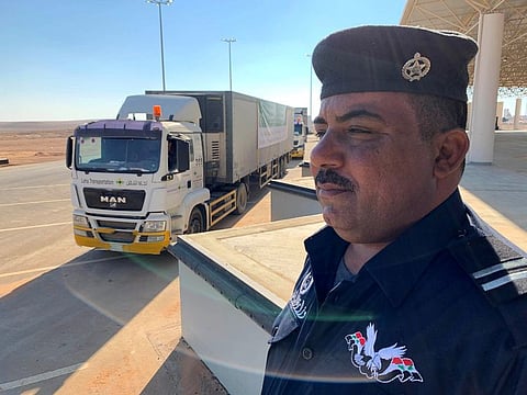A truck carrying aid donated by Saudi Arabia makes its way into Iraq after the opening of Saudi-Iraqi border in Arar, Saudi Arabia, November 18, 2020. REUTERS/Maher Nazeh